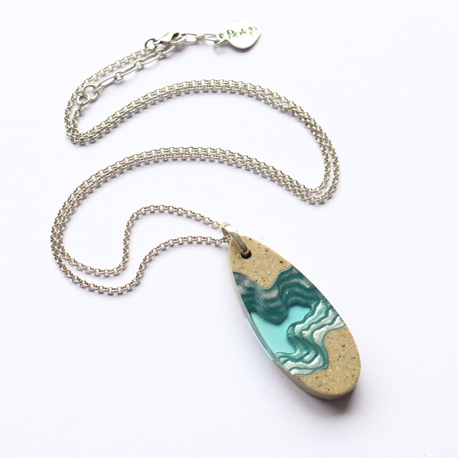 Fjord necklace on white background