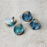 Ridge earrings on sand