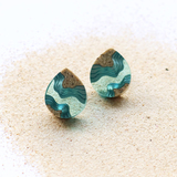 Aquamarine ridge ear studs sitting up