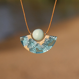 Reef curved resin necklace with amazonite on beach